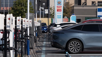Electric vehicle charging stations are seen in Beijing, Friday, Oct. 11, 2024.