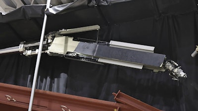 Tokyo Electric Power Company Holdings, also known as TEPCO, the operator of Japan's wrecked Fukushima Daiichi nuclear power plant, reveals a robot to be used to retrieve debris at the power plant in Kobe, western Japan, May 28, 2024.