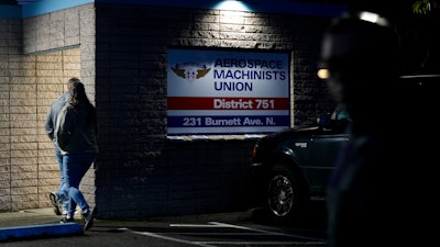 Boeing employees arrive to vote on a new contract offer from the company Monday, Nov. 4, 2024, at the Aerospace Machinists Union hall in Renton, Wash.