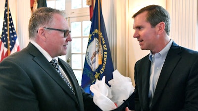 Colin Parkin, left, President of e-Storage, speaks with Kentucky Governor Andy Beshear following the announcement of a $712 million project in Shelbyville, Ky., creating 1,572 skilled, high-tech jobs at the Governor’s Mansion in Frankfort, Ky., Friday, Nov. 15, 2024.