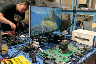 Employees work behind an evaluation board, foreground, in a lab at the d-Matrix office in Santa Clara, Calif., Wednesday, Oct. 16, 2024.