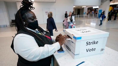 LaQuanda Harvey, a Prospect airport service worker, votes in favor of a strike at Charlotte Douglas International Airport, Friday, Nov. 22, 2024, in Charlotte, N.C.