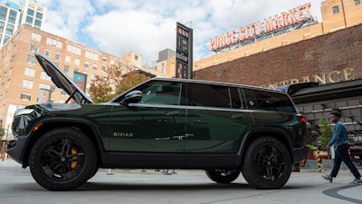 A Rivian R1S is displayed outside of the auto manufacturer's new space at Ponce City Market on Oct. 19, 2023, in Atlanta.