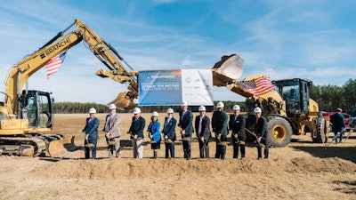 Microporous representatives digging the first holes for the new facility megasite.