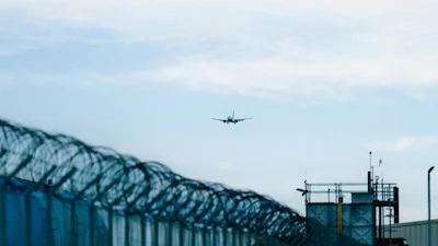 An aircraft approaching a runway.