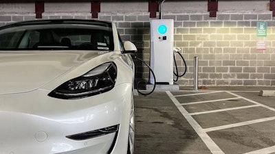 An XCharge NA charger charging an EV.