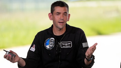 Commander Jared Isaacman speaks at a news conference after arriving at the Kennedy Space Center for an upcoming private human spaceflight mission in Cape Canaveral, Fla., Monday, Aug. 19, 2024.