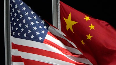 The American and Chinese flags wave at Genting Snow Park ahead of the 2022 Winter Olympics, in Zhangjiakou, China, Feb. 2, 2022.