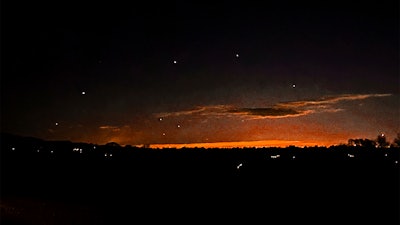 This photo provided by Trisha Bushey shows the evening sky and points of light near in Lebanon Township, N.J., on Thursday, Dec. 5, 2024.