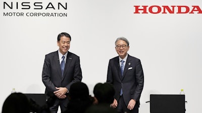 Nissan Chief Executive Makoto Uchida, left, and Honda President Toshihiro Mibe attend a joint news conference in Tokyo, Friday, March 15, 2024.