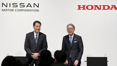 Nissan Chief Executive Makoto Uchida, left, and Honda President Toshihiro Mibe attend a joint news conference in Tokyo, Friday, March 15, 2024.