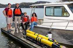 Center for Marine Autonomy and Robotics students and Co-Director Dan Stilwell (second from left) with underwater autonomous subs at Claytor Lake, near Virginia Tech's Blacksburg campus.