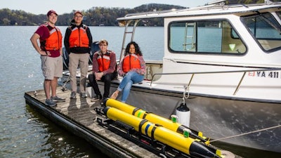 Center for Marine Autonomy and Robotics students and Co-Director Dan Stilwell (second from left) with underwater autonomous subs at Claytor Lake, near Virginia Tech's Blacksburg campus.