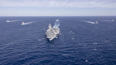 The world's largest aircraft carrier, USS Gerald R. Ford (CVN 78), sails in formation with the Arleigh Burke-class guided missile destroyers USS Winston Churchill (DDG 81), USS Mitscher (DDG 57), USS Mahan (DDG 72), USS Bainbridge (DDG 96), and USS Forrest Sherman (DDG 98) in the Atlantic Ocean, Nov. 12, 2024.
