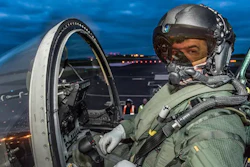 A jet pilot wearing the Striker II Helmet.