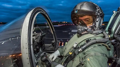 A jet pilot wearing the Striker II Helmet.