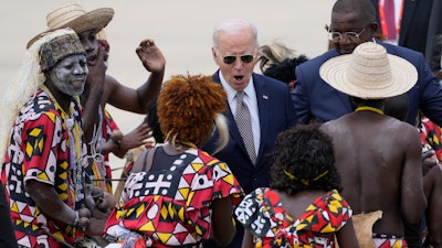 President Joe Biden watches a traditional dance after arriving at Catumbela airport in Angola on Wednesday, Dec. 4, 2024.