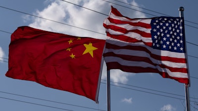 The Chinese and United States flags are flown outside the China International Supply Chain Expo in Beijing, Nov. 27, 2024.