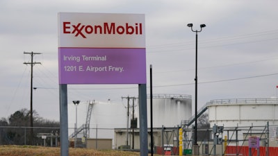 A sign marks the entrance to an ExxonMobil fuel storage and distribution facility in Irving, Texas, Jan. 25, 2023.