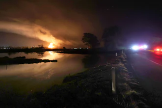 Flames and smoke from a fire fill the sky at the Moss Landing Power Plant Thursday Jan. 16, 2025 in Moss Landing, Calif.