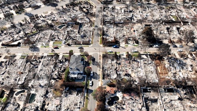 A lone residence is left standing amid the devastation from the Palisades Fire, in an aerial view, in the Pacific Palisades neighborhood of Los Angeles, Monday, Jan. 27, 2025.