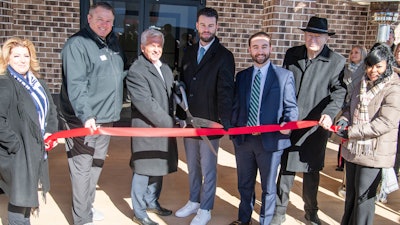 Jeff Morgan, President of EWA Warrior Services, a Sigma Defense Division, is joined by representatives from the office of Congressman Dale Strong, Alabama’s 5th Congressional District, representatives from Huntsville mayor’s office, Tommy Battle, and members of the Huntsville Chamber of Commerce for the opening of the new Huntsville office.