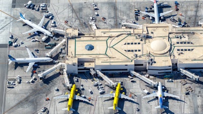 Airplanes from jetBlue and Spirit Airlines at Los Angeles Airport (LAX) aerial view in the United States.