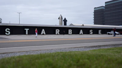 Visitors pose for photos at SpaceX's complex at Starbase in Boca Chica, Texas, Monday, Jan. 13, 2025.
