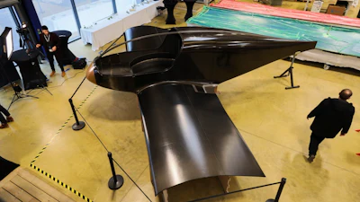 The Climate Impulse, a plane powered by liquid hydrogen, is displayed in a hangar in Les Sables d'Olonne, France on Thursday, Feb. 13, 2025.