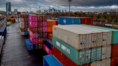 Containers are stacked at the cargo terminal in Frankfurt, Germany, Friday, Dec. 6, 2024.