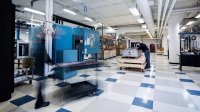 BAE Systems employees working on production in the electrification lab.