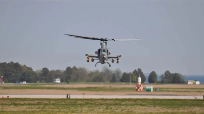 An AH-1Z Viper launching a single weapon by way of a wireless application.