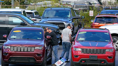 Shoppers examine used Jeep Grand Cherokees at a dealership in Pittsburgh on Sept. 29, 2022. The stress and expense of buying a used vehicle can be greatly reduced if you avoid common mistakes.
