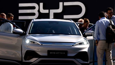 Visitors check the China made BYD ATTO 3 at the IAA motor show in Munich, Germany, on Sept. 8, 2023.