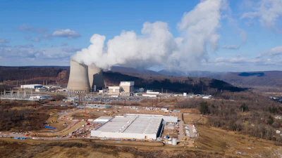 A data center owned by Amazon Web Services, front right, is under construction next to the Susquehanna nuclear power plant in Berwick, Pa., on Tuesday, Jan. 14, 2024.