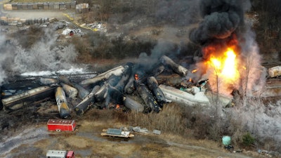 Portions of a Norfolk Southern freight train that derailed the night before burn in East Palestine, Ohio, Feb. 4, 2023.