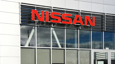 The front of a Nissan dealership.