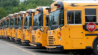 School busses are parked at a garage in Jackson Township, Pa., on July 11, 2024.