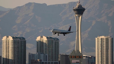 Delta Air Lines flight lands at Harry Reid International Airport, Wednesday, April 9, 2025, in Las Vegas.