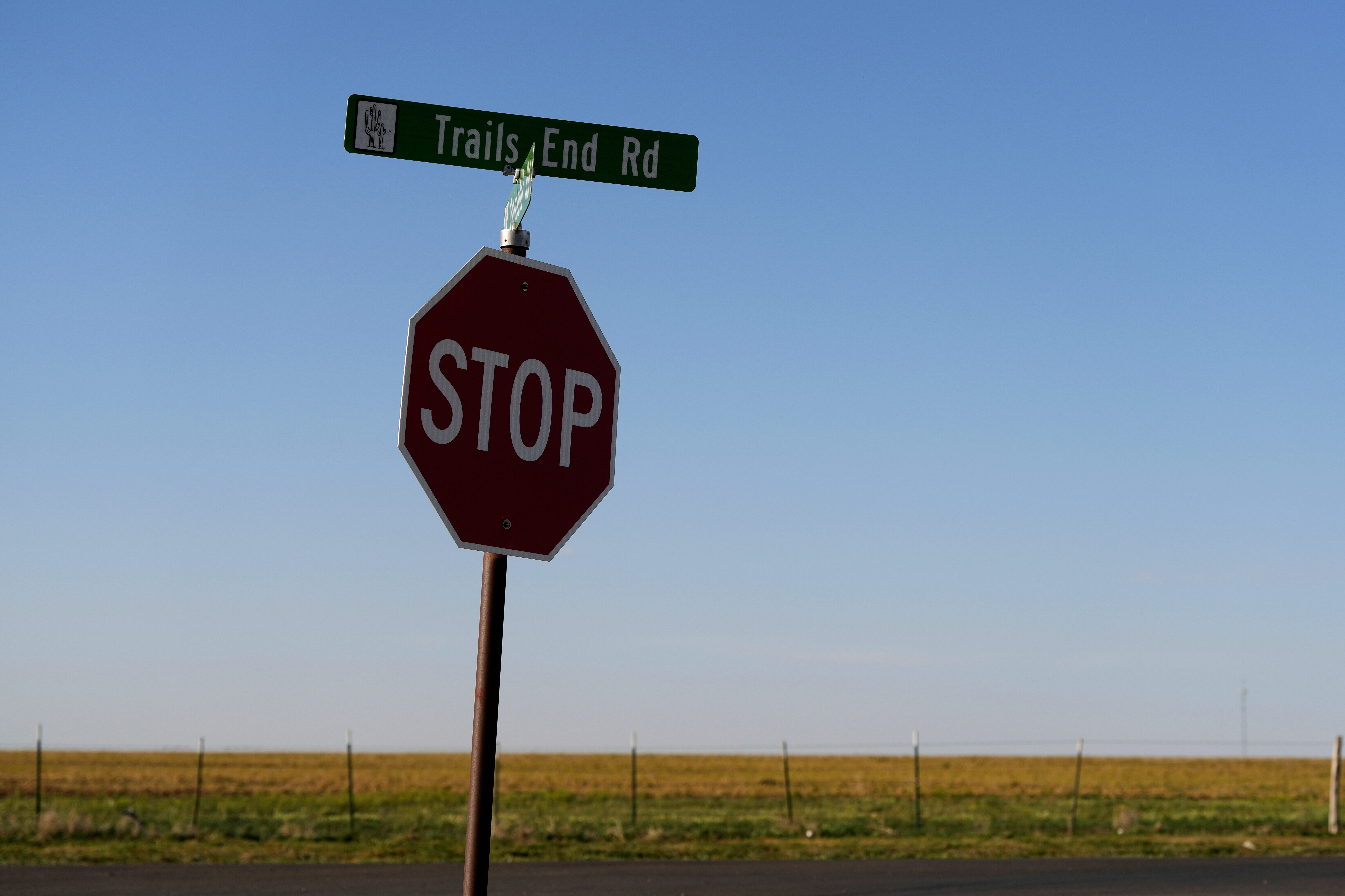 A sign for Trails End Road, home to the JBS meat processing plant, rests on a stop sign, Tuesday, April 15, 2025, in Dumas, Texas.