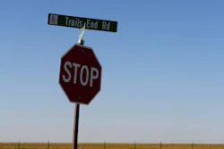 A sign for Trails End Road, home to the JBS meat processing plant, rests on a stop sign, Tuesday, April 15, 2025, in Dumas, Texas.