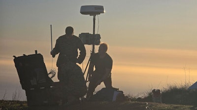 U.S. Marines and Collins Aerospace team members assemble nodes at dawn during Project Convergence Capstone 5.