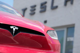 A Model X sports-utility vehicle sits outside a Tesla store in Littleton, Colo., June 18, 2023.