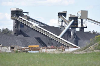 A pile of coal, conveyor belts and towers for moving and storing coal are seen at Signal Peak Energy's Bull Mountains Mine, on May 21, 2025, near Roundup, Montana.