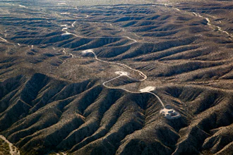This aerial photo taken on Nov. 13, 2023, by Archaeology Southwest with a volunteer pilot and Lighthawk, a nonprofit organization, shows access roads and tower pad sites west of the San Pedro River, near Redrock Canyon, in Arizona.