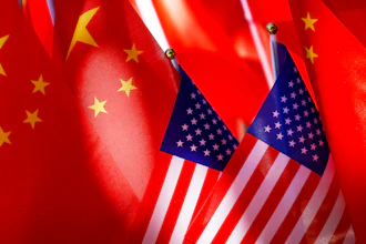 American flags are displayed together with Chinese flags on top of a trishaw on Sept. 16, 2018, in Beijing.