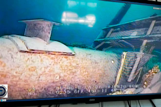 In this photo shot from a television screen provided by the Michigan Department of Environment, Great Lakes, and Energy in June 2020, shows damage to anchor support EP-17-1 on the east leg of the Enbridge Line 5 pipeline within the Straits of Mackinac in Mich.