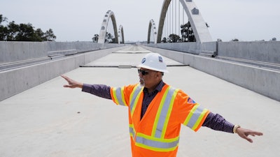 Garth Fernandez, Central Valley regional director for the California High-Speed Rail Authority, talks about the Cedar Viaduct in Fresno, Calif., April 15, 2025.
