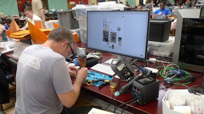 Participants gather for the London Defence Tech Hackathon, a weekend brainstorming solution for technical challenges, at the Royal Military Academy Sandhurst in Camberley, England, May 10, 2025.
