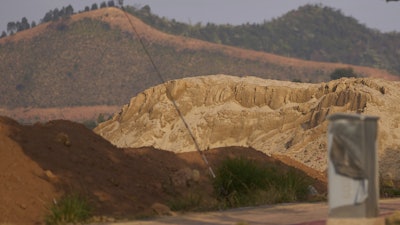 Piles of earth are seen in Ganzhou in southern China's Jiangxi province on March 19, 2025.